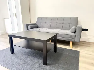 a living room with a couch and a coffee table at Princes road hidden gem in Liverpool
