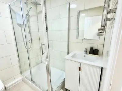 a bathroom with a shower and a sink and a toilet at Princes road hidden gem in Liverpool