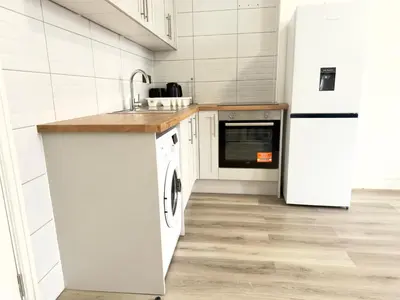 a kitchen with a sink and a dishwasher at Princes road hidden gem in Liverpool