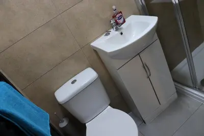 a bathroom with a white toilet and a sink at Anfield 5bed 5bath cosy group retreat in Liverpool
