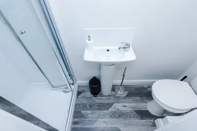 a bathroom with a toilet and a sink at Spacious 6-Bedroom Central Blackpool in Blackpool