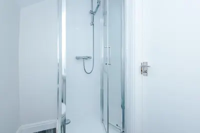 a shower in a bathroom with a glass door at Spacious 6-Bedroom Central Blackpool in Blackpool