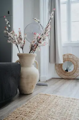 a white vase with flowers in a living room at Central L1 Stay, Close to all Attractions, Parking Nearby in Liverpool