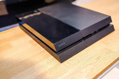 a black router sitting on top of a wooden table at Monthly & Weekly Offers , Pool Table , PS4 , Liverpool , 3 Bed House , Ideal For Contractors , Relocation & Family Stays in Litherland