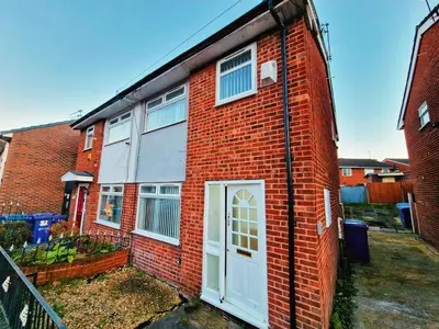 a red brick building with a white door at Amazing Spacious 3BDR Home Near LFC Stadium in Liverpool