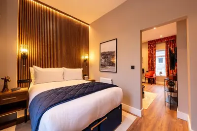 a bedroom with a large bed in a room at The Terrace - A St David Aparthotel in Barrow