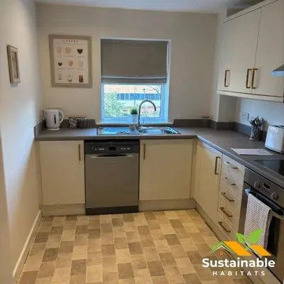 a kitchen with a sink and a dishwasher at Sustainable Habitats- Berkley House apartment in Blackpool