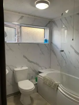 a bathroom with a toilet and a tub and a sink at Skylight Loft, 2 bed apartment, central Lancaster in Lancaster