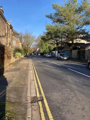 a street with cars parked on the side of the road at Skylight Loft, 2 bed apartment, central Lancaster in Lancaster