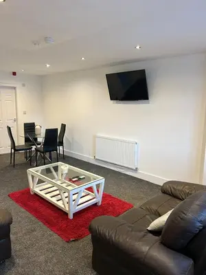 a living room with a couch and a coffee table at Cosy flat Lytham St Annes - Sleeps 2 with parking in Lytham St Annes