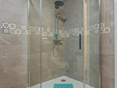 a shower with a glass door in a bathroom at Large House in Central Ulverston Sleeps 10 - Pass the Keys in Ulverston