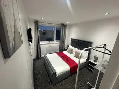 a hotel room with a bed and a window at NEW PCK Thas Hotel BLACKPOOL in Blackpool