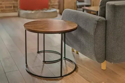 a small wooden table sitting next to a couch at GuestReady - Cozy retreat in vibrant Liverpool in Liverpool