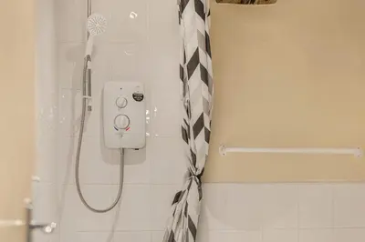 a shower in a bathroom with a shower at GuestReady - Cozy retreat in vibrant Liverpool in Liverpool