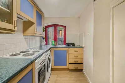 a kitchen with a stove and a sink at GuestReady - Cozy retreat in vibrant Liverpool in Liverpool