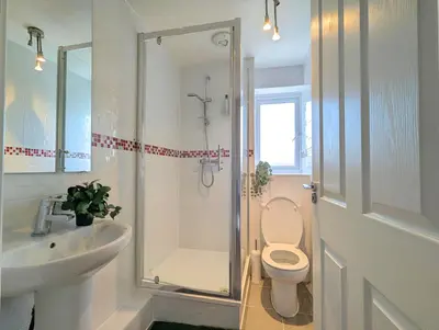 a bathroom with a shower and a toilet and a sink at Guest Rooms Near Centre & Anfield Free Parking in Liverpool