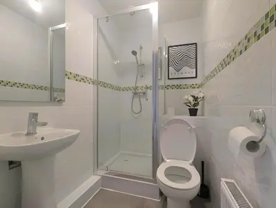 a bathroom with a toilet and a sink and a shower at Guest Rooms Near Centre & Anfield Free Parking in Liverpool