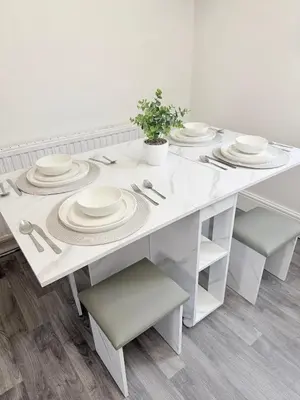 a white dining room table with white dishes on it at Deepdale House - Comfortable 2 Bedroom Home near Major Attractions in Preston in Preston