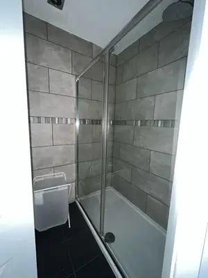 a bathroom with a shower and a sink at Spacious Home From Home, Parking, Contractors in Liverpool