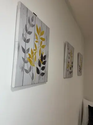three paintings on a wall in a room at City-Close Studio By Escape & Estates Short Lets & Serviced Accommodation Liverpool with Free parking and Wifi in Liverpool