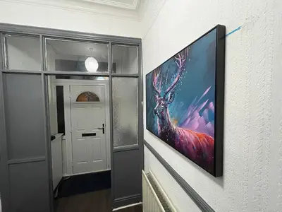 a painting of a deer hanging on a wall at Liverpool 4-Bed Home, Free Parking in Liverpool