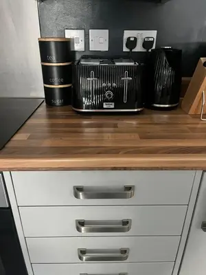 a kitchen counter with a wooden counter top at The Works Apartments in Liverpool
