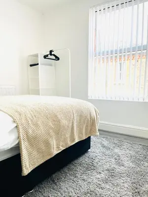 a bedroom with a bed and a window at Clovelly Road, Anfield LFC in Liverpool
