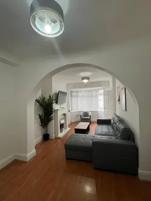 a living room with a couch and a table at 3BR Home, Parking, Families, Contractors, Wi-Fi in Liverpool
