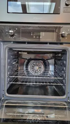 an oven with its door open with its rack at 1 Sunset View in Millom