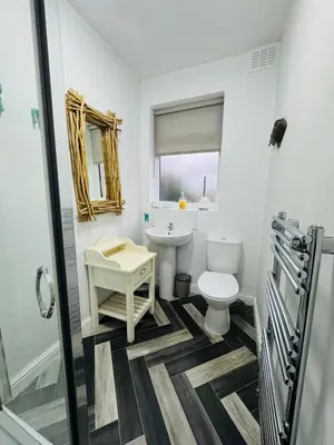 a bathroom with a toilet and a sink at Hillside Stays - Cosy 2 Bed Bungalow, Pet Friendly in Blackpool