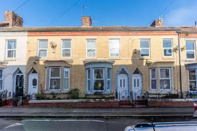 a large brick house on a city street at The Kensington House in Liverpool