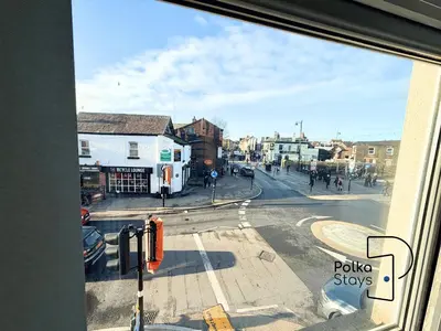 a view of a city street from a window at Sleeps 10 Spacious for Contractors by PolkaStay in Ormskirk