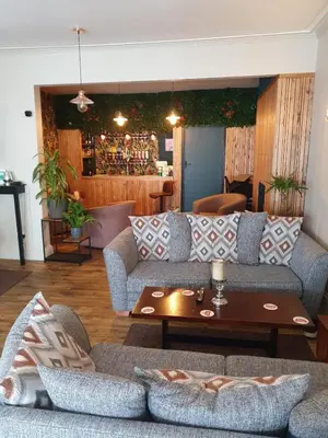 a living room with a couch and a table at The Lenbrook in Blackpool