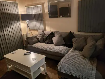 a living room with a couch and a table at 47 Venture Caravan Park in Morecambe