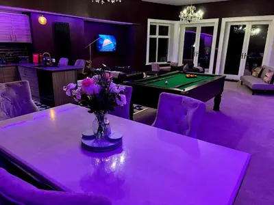 a purple room with a table with a pool tableablish at Hamilton Luxury - The James Suite in Scorton