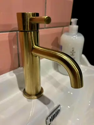 a bathroom sink with a gold faucet at Hamilton Luxury - The James Suite in Scorton