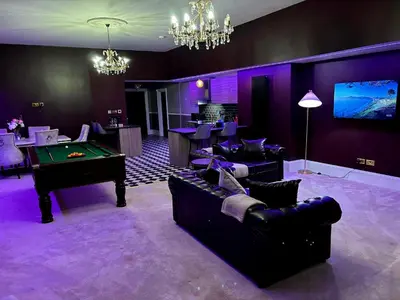a living room with couches and a pool table at Hamilton Luxury - The James Suite in Scorton