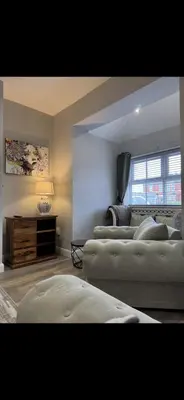 a living room with two couches and a couch at Comfortable 2BR Home in Southport up to 6 guest in Southport