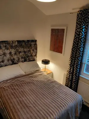 a bedroom with a bed and a window at Cottage terrace Blackpool in Blackpool