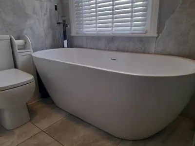 a white bath tub in a bathroom with a toilet at Cottage terrace Blackpool in Blackpool