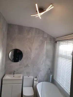 a bathroom with a toilet and a ceiling fan at Cottage terrace Blackpool in Blackpool