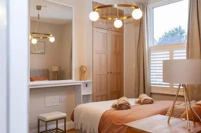 a bedroom with a bed and a window at #104 Luxury 4 bed beautiful house in Liverpool in Liverpool