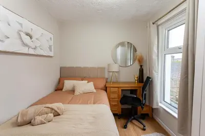 a bedroom with a bed and a desk and a mirror at #104 Luxury 4 bed beautiful house in Liverpool in Liverpool