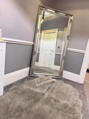 a mirror in a room with a rug and a door at Fulwoodroomz in Preston