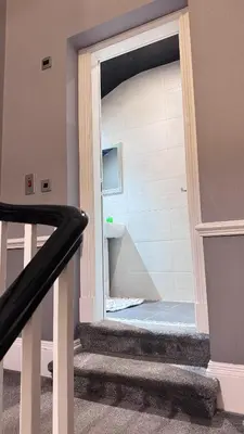 a staircase with a door open to a bathroom at Fulwoodroomz in Preston