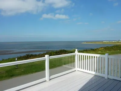 a balcony with a view of the ocean at Shrimp Shack in Heysham