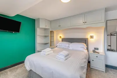 a bedroom with a white bed with towels on it at 3 Bed in Southport oc-h32625 in Southport
