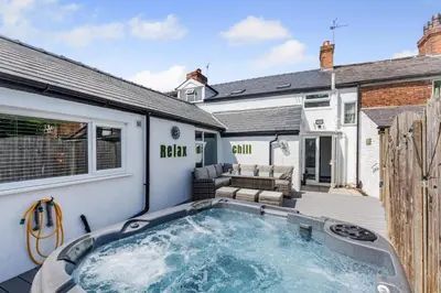 a swimming pool in the backyard of a house at 3 Bed in Southport oc-h32625 in Southport