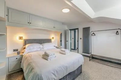 a bedroom with a large bed with towels on it at 3 Bed in Southport oc-h32625 in Southport