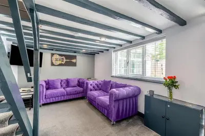 a living room with purple couches and a window at 2 Bed in Southport oc-h32626 in Southport